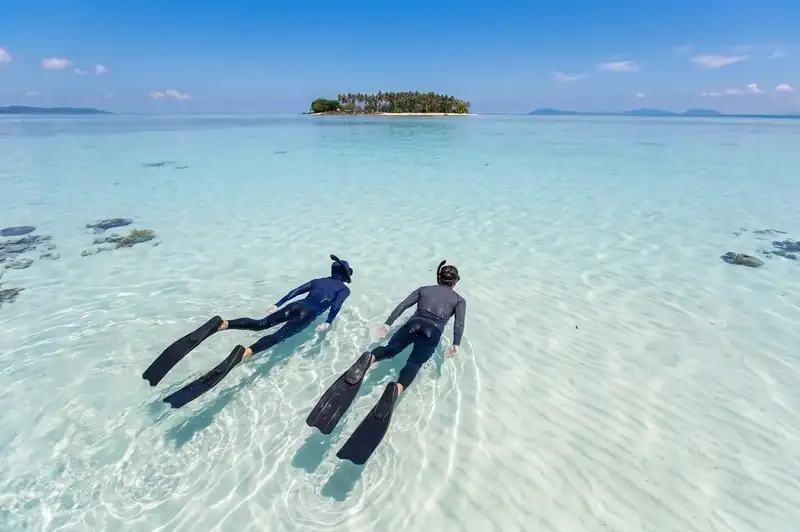 Snorkeling the vibrant reefs of Tun Sakaran Marine Park with Fairyland Resort in the Semporna archipelago.